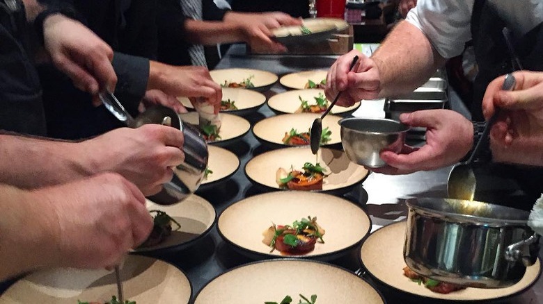 Chefs at lazy bear preparing food