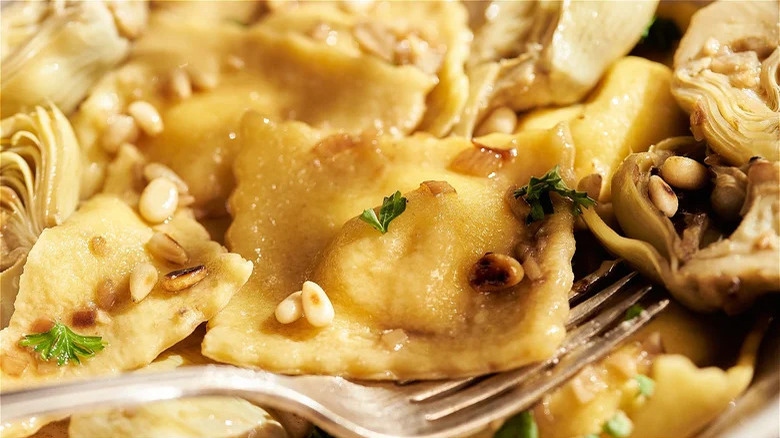 Cheese ravioli with lemon-artichoke sauce