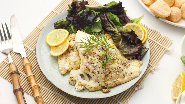 Haddock on plate with greens