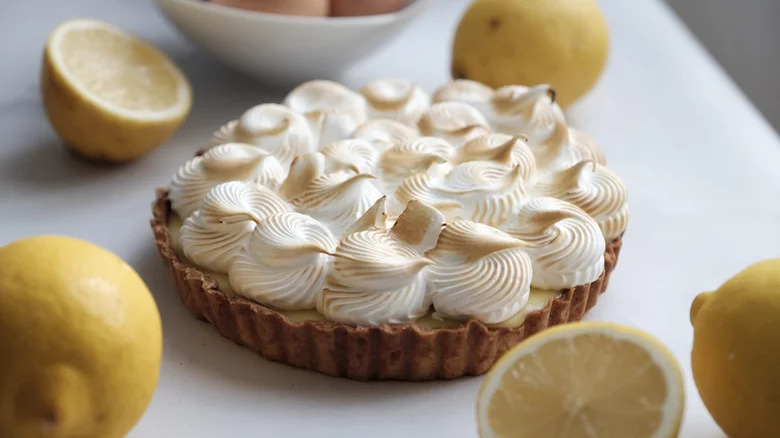 Lemon meringue pie on table