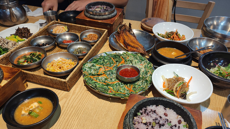 Table loaded with Korean dishes