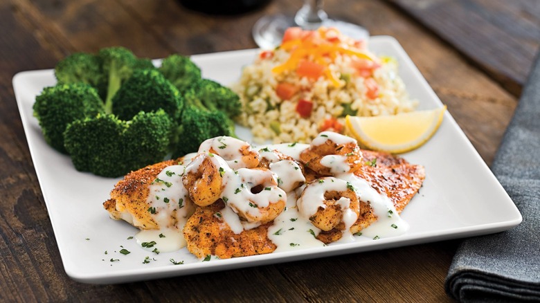 Tilapia, shrimp, rice, and broccoli