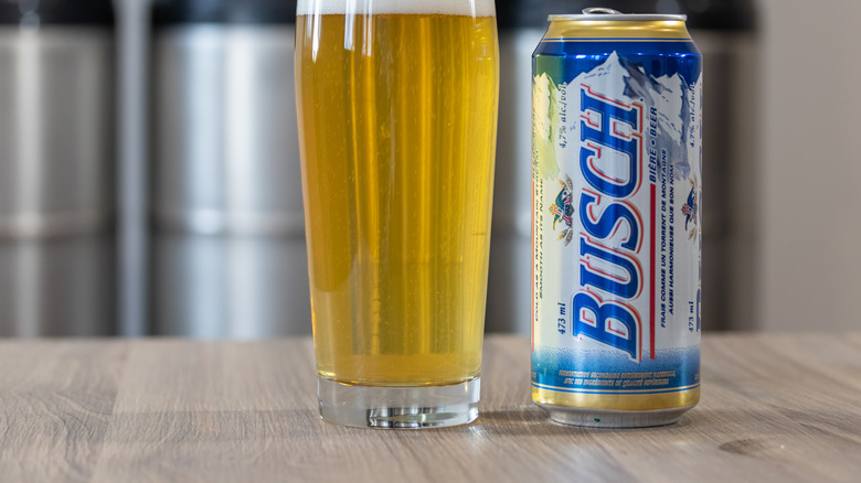 can and glass of Busch