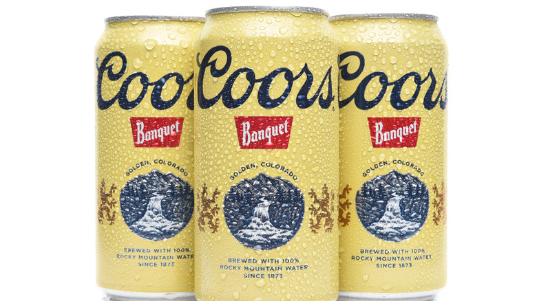 three cans of Coors Banquet 