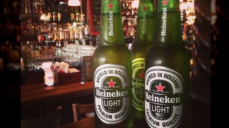 three bottles of Heineken Light