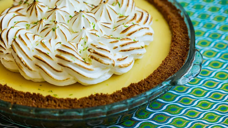 Key lime pie with toasted meringue topping and lime zest
