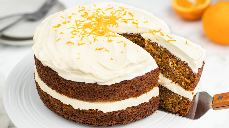 orangey carrot cake being sliced