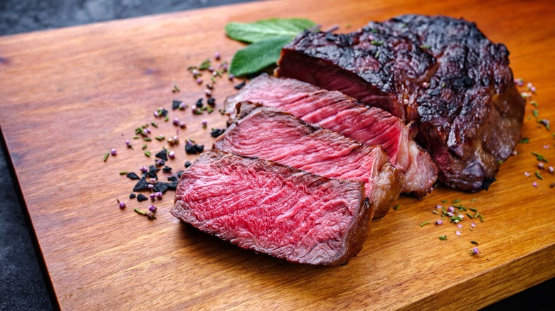 broiled steak on cutting board