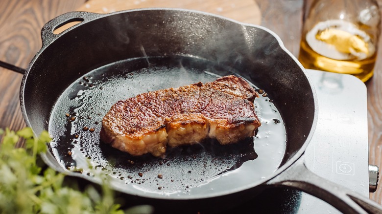 steak in cast-iron skillet