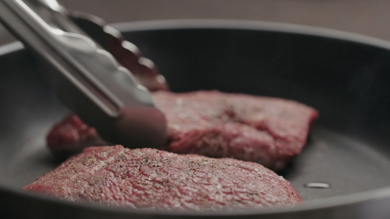 steaks in nonstick pan