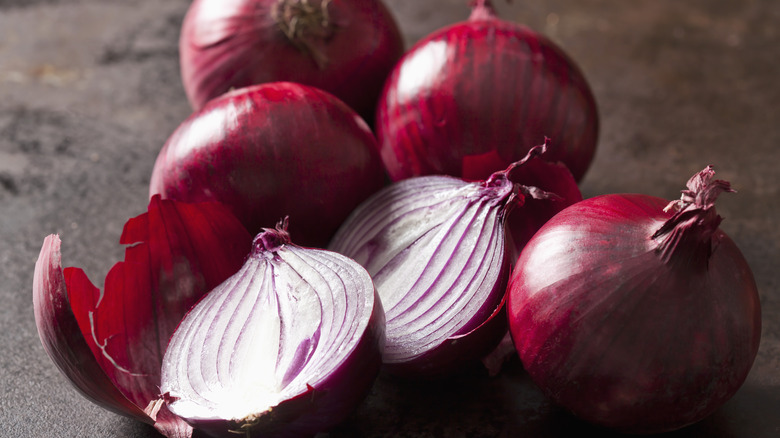Halved and whole red onions