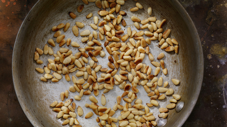 toasted pine nuts in pan