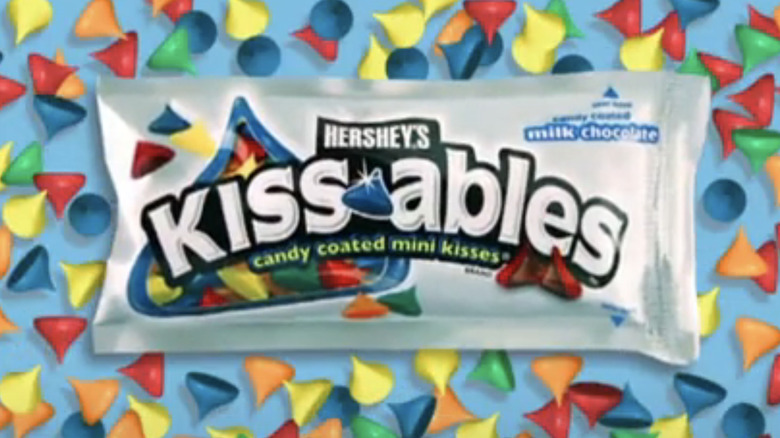 Hershey's Kissables wrapper surrounded by colorful kissable chocolates