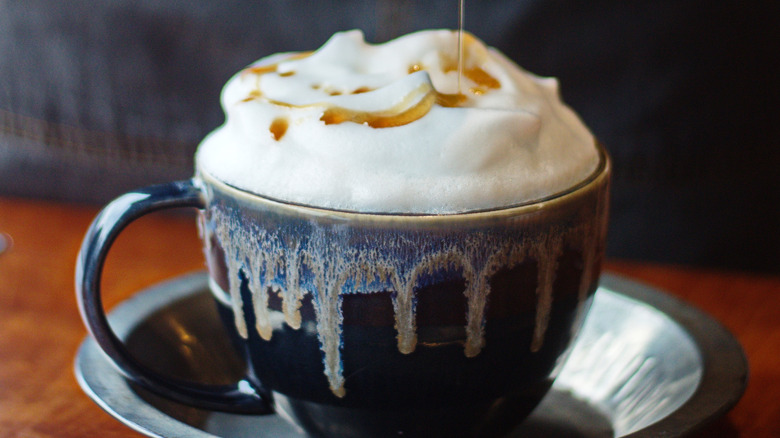 Foamy drink topped with syrup