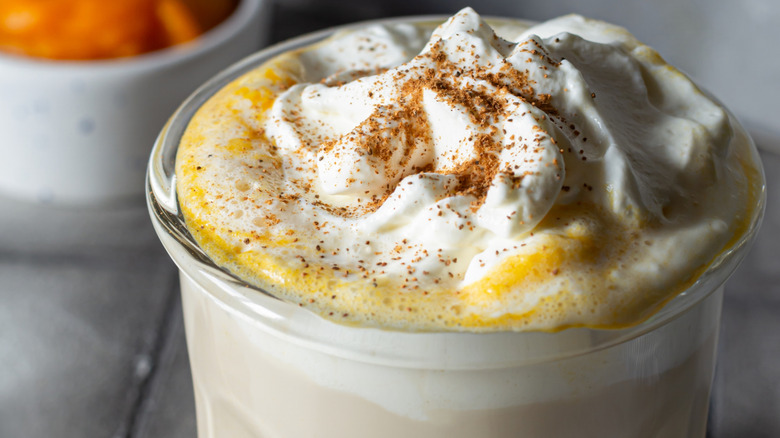Smoothie with whipped cream and spices