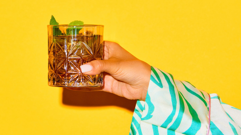 Old fashioned on bright yellow background