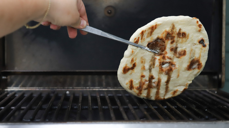 Fresh flatbread on gas grill