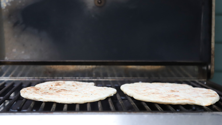 Two flatbreads on grill