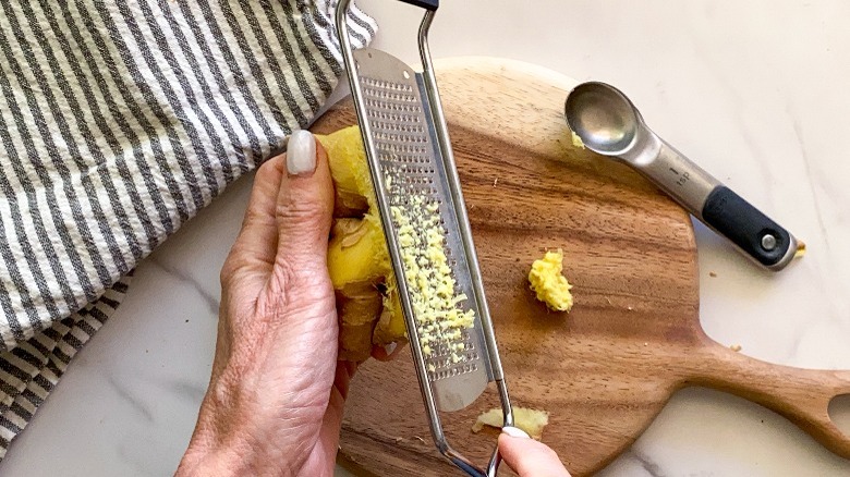 hand grating ginger