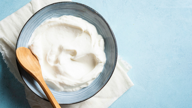 Greek yogurt in a bowl with a spoon