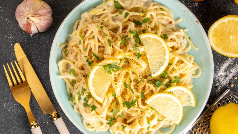 Overview of lemon garlic pasta on a blue plate