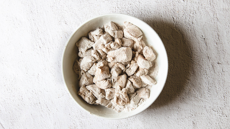 Chicken in coating in bowl