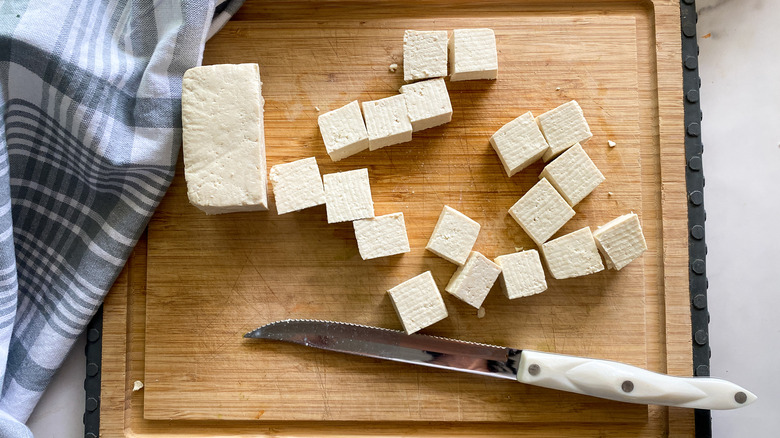 cubed tofu on cutting board