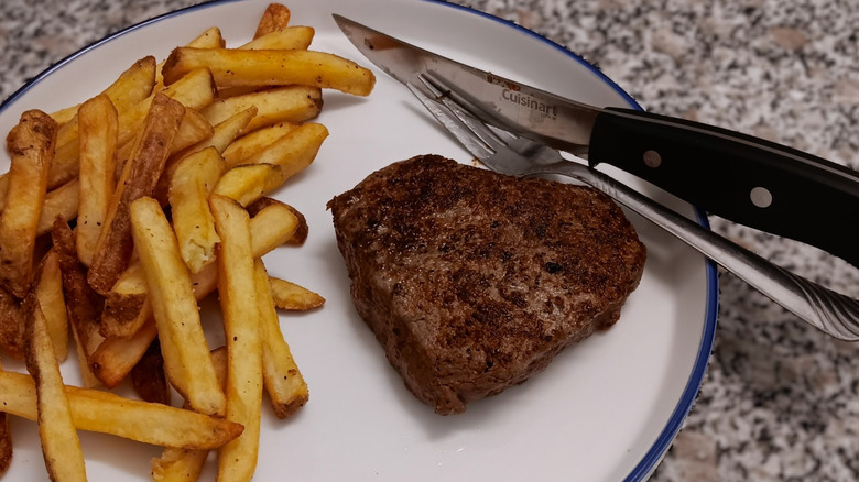 LongHorn Steakhouse filet with fries on plate
