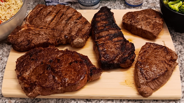 5 different cuts of steak from LongHorn Steakhouse with sides and salt