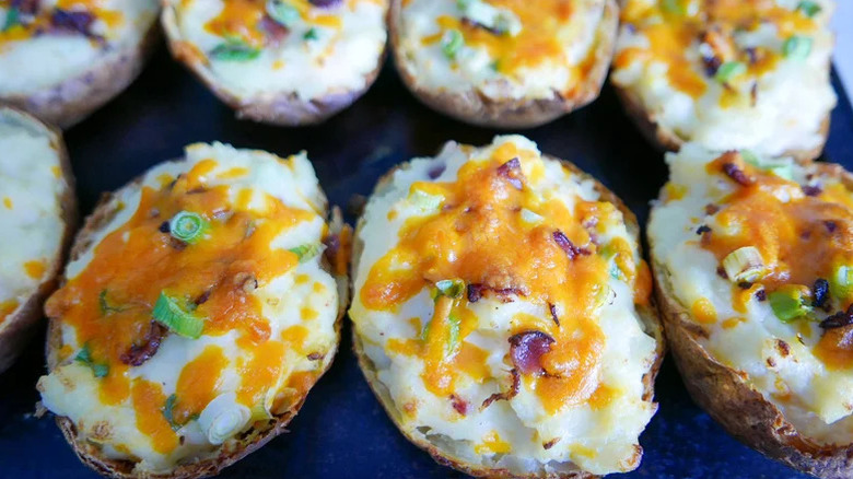 Several cheesy twice baked potatoes