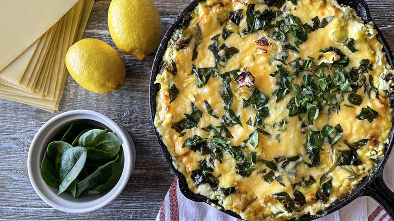 cast iron pan lasagna with spinache and lemons