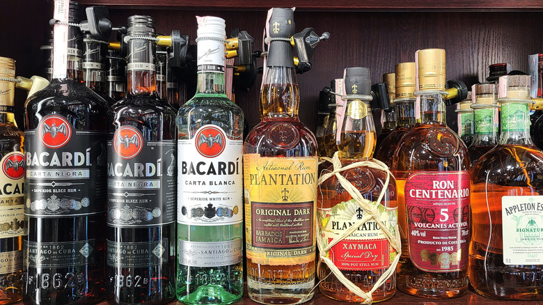 bottles of rum from different brands on shelf