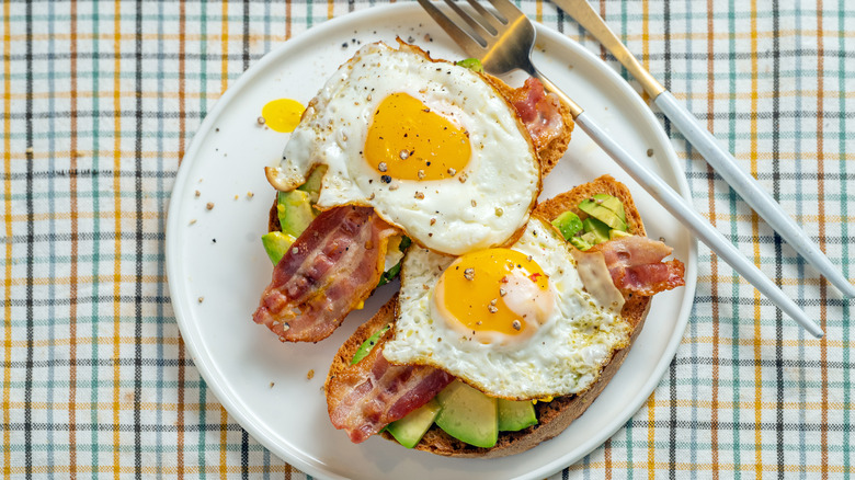 fried eggs on avocado toast