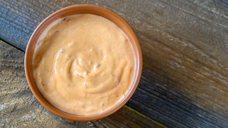 a small bowl of buffalo mayo