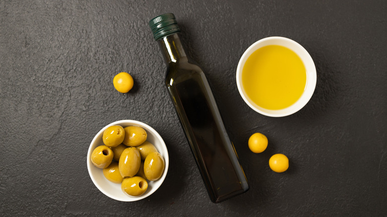 olives and a dark glass bottle