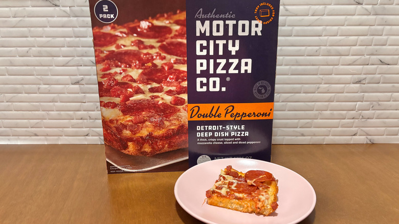 Motor City Pizza Co Detroit-style pepperoni pizza box next to pizza slice on plate