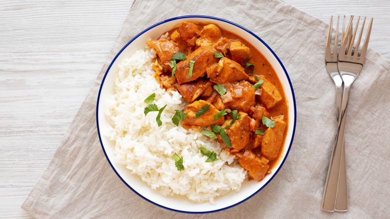 Bowl of butter chicken and white rice