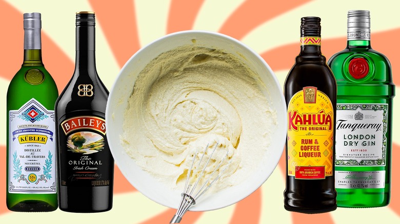 Cake batter being whisked, surrounded by bottles of absinthe, Baileys, Kahlúa, and gin