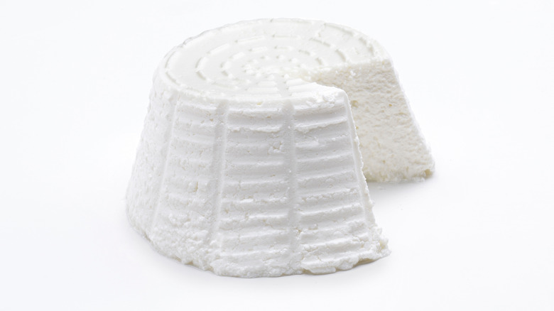 Ricotta cheese on white background 