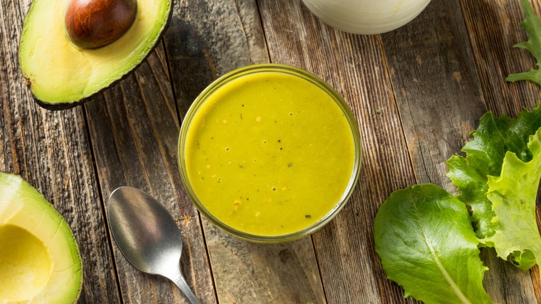 Overview of green goddess dressing in a bowl with avocado