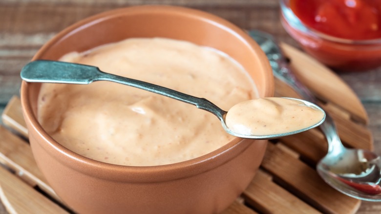 Thousand Island dressing in a bowl with spoon