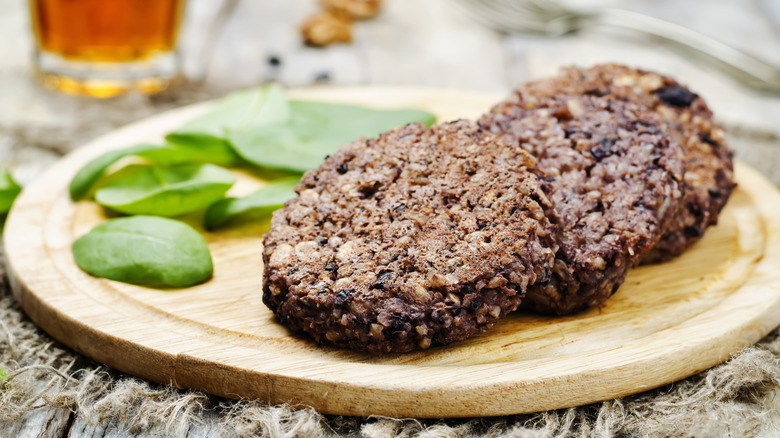 Black bean burger patties on wood board