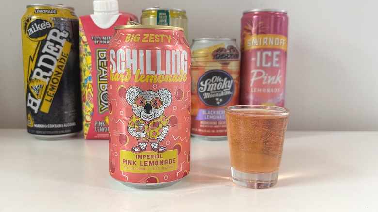 Schilling Imperial Pink Lemonade next to shot glass of lemonade on white table