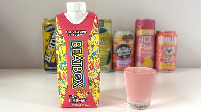 Beatbox Pink Lemonade next to shot glass of lemonade on white table