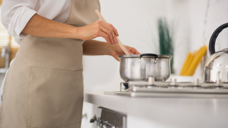 stirring metal saucepan