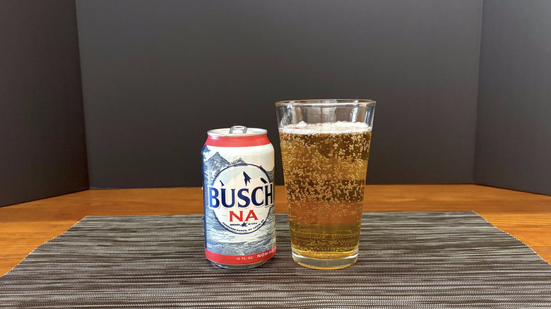 Busch NA in pint glass on dark bar mat