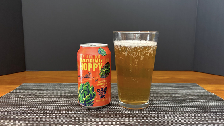 Hoplark 0.0 really really hoppy in pint glass on bar mat
