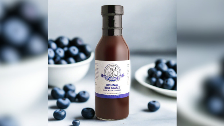 Uncle Clarence blueberry bbq sauce with real blueberries in background