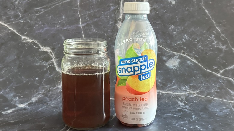 Snapple tea bottle with glass