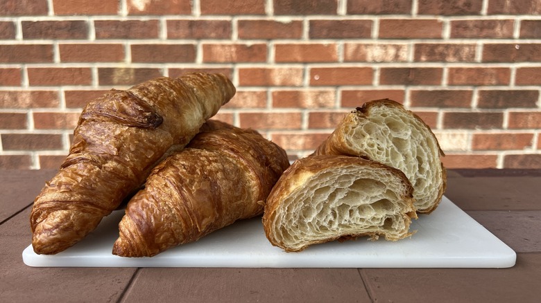 Butter croissants, one sliced